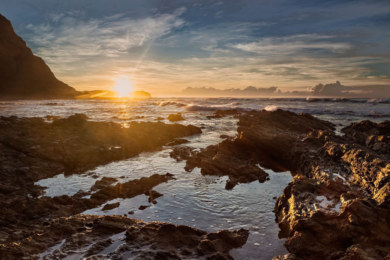 Gorgeous sunrise picture at the rocky seashore of Playa Escondida - Nicoya Peninsula Costa Rica